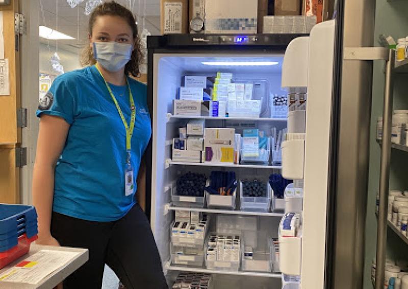 Katie Reilly in front of refrigerated medications