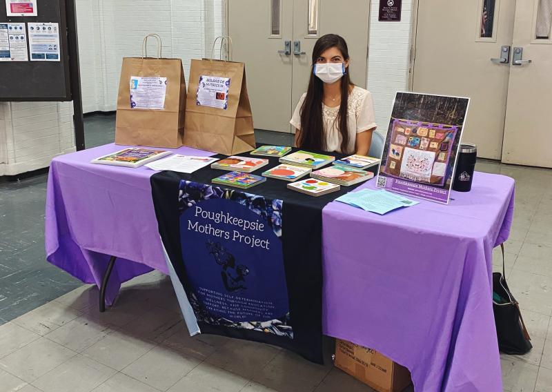 Erin tabling for Poughkeepsie Mothers Project.