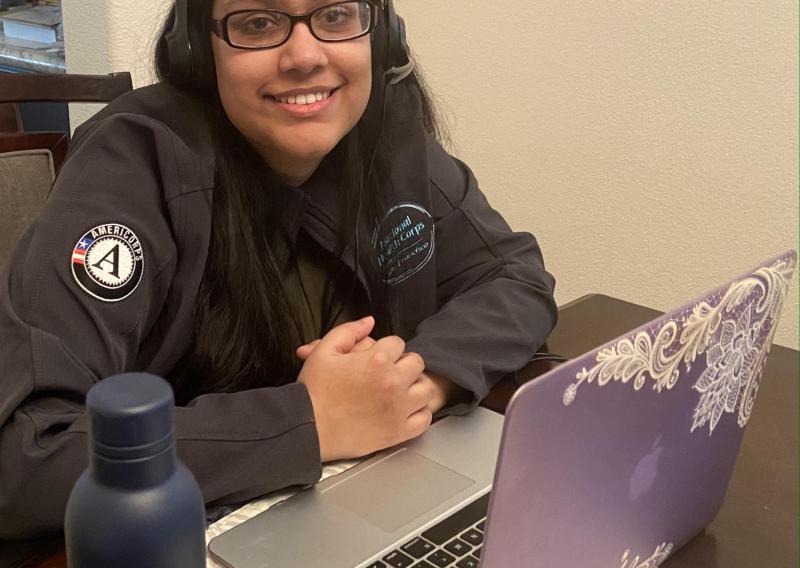 Tahemina Munir in front of her laptop as she serves from home.