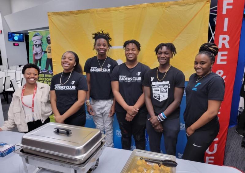 Pictured is Eliza Leslie with teens from the Johnson YMCA Leaders Club