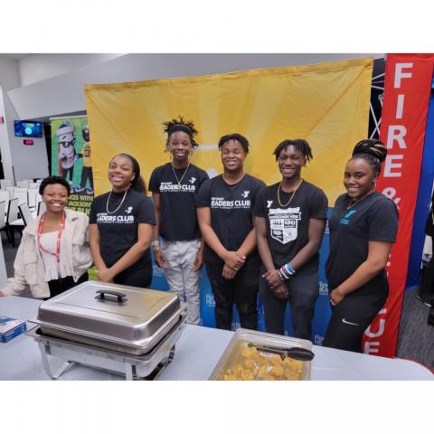 Pictured is Eliza Leslie with teens from the Johnson YMCA Leaders Club