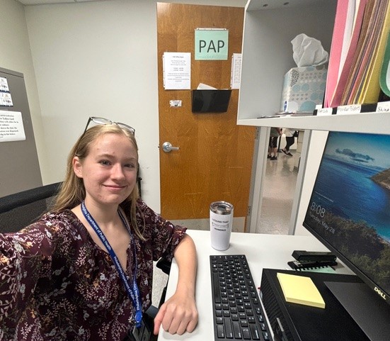 Maddie sitting at desk