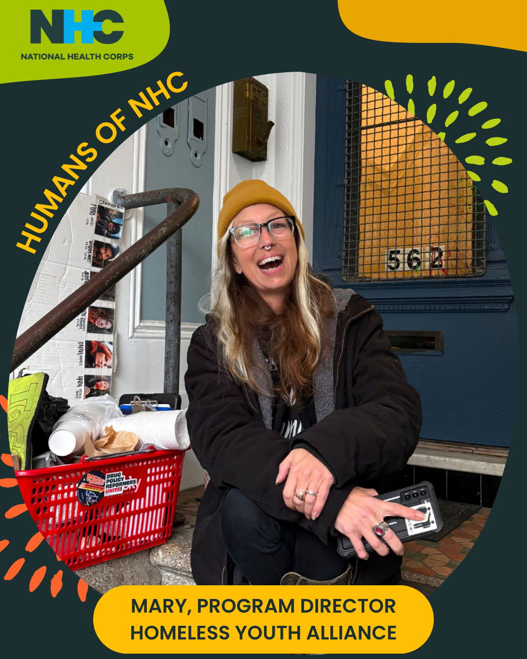 A frame with the text "Humans of NHC" and "Mary, Program Director, Homeless Youth Alliance" circles the photo of a woman sitting on the top of a staircase leading to a front door. She is facing the camera and smiling. Next to her right arm is a grocery basket filled with materials, including compostable cups and tote bags, among other resources.